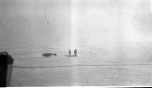 Image: Team on ice near ship