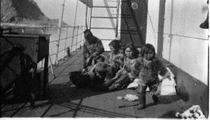 Image: Eskimo [Inuit] women and children sitting on deck