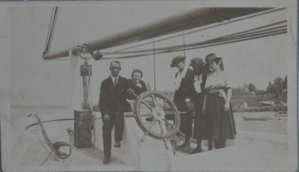 Image of The Bowdoin with Jot Small at the helm with four unidentified women