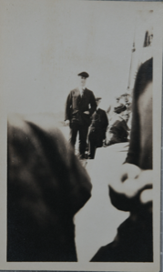 Image of Donald B. MacMillan on the deck of the Bowdoin; Jerry Look probably fifth figure