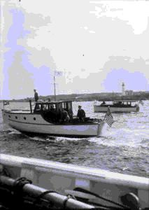 Image of Boats following Bowdoin out of Portland harbor, taken from Bowdoin