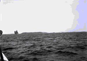 Image: Newfoundland fishing schooner Linda Tibbo and distant iceberg
