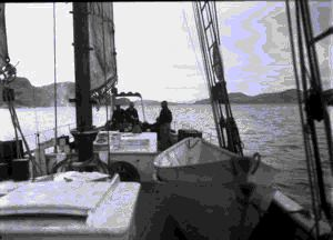 Image of Looking astern from Kauk showing some of the fellows on board. On the way 