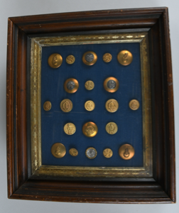 Image: Framed collection of 21 metal buttons related to Robert E. Peary and/or the Arctic