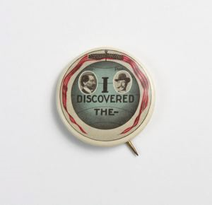 Image of Lapel pin, "I Discovered The --," with vignettes of Cook and Peary