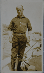 Image: Donald B. MacMillan standing on the deck of a ship