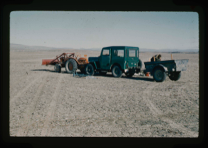 Image of Tractor and jeep with trailer were the field transports to prepare runway.