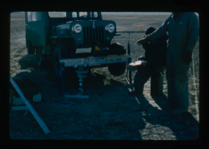 Image of Loading jeep to provide soil engineering data in testing of runway.