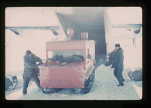 Image: Unloading of weasel snow vehicle from C-130 ski aircraft on Centrum Lake