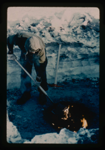 Image: Digging in permafrost at Centrum Lake, snow cover of 2 ft. Use of oil fire to m