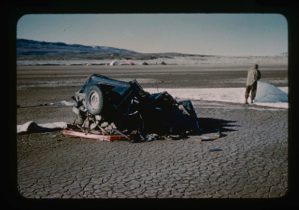 Image: Wrecked air-dropped jeep; parachutes mark airfield runway at Bronlunds Fjord