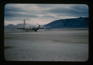 Image: C-124 aircraft test landing on natural surface runway at Bronlunds Fjord.