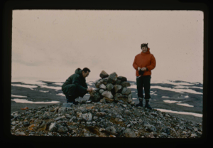 Image of Dan Krinsley of U.S. Geological Survey  and ? inspect cairn on Cape George Cohn 