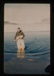Image of Dan Krinsley crossing moat of Centrum Lake, wearing exposure suit