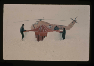Image: Krinsley and 'copter pilot erecting para-igloo tent in snow by Arctic Ocean. 