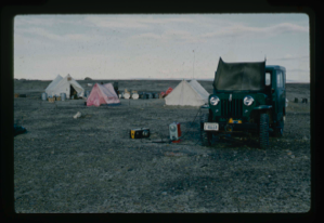 Image of Jeep battery being recharged at base camp.
