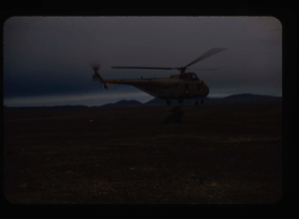 Image: US Navy helicopter from USS Atka airlifting jeep trailer over Polaris Promontory