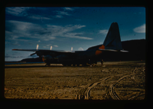 Image: Test landing at airstrip, natural surface of raised delta. C-130 aircraft parked