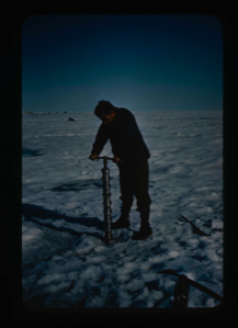 Image of Coring the snow-ice cover of the lake (Lake Peters)