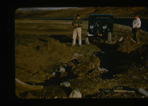 Image of Digging out jeep from soft permafrost. Lt. Col. Wilson and Capt. Klick