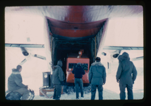 Image of Weasel being unloaded from C-130 aircraft on lake of snow-ice cover
