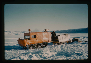 Image of Weasel transporting equipment and supplies from cache on Centrum Lake.