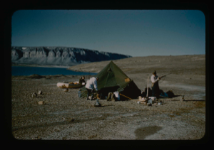 Image of Use of a 5 man canvas tent staked down and weighted by large boulders
