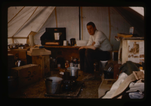 Image: Craven, radio operator and technical assistant in kitchen tent.
