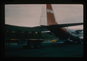 Image of C-130 aircraft being loaded with airdrop bundles of fuel, food and equipment 