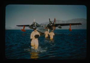 Image: Crew members leave SA-16 aircraft in special exposure suits in Centrum Lake.