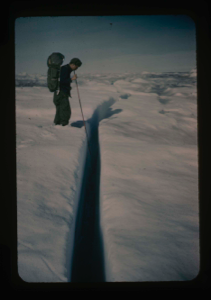 Image of Cabaniss examines hinge crack between ice island T-3 and pack ice 
