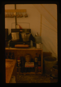 Image: View of well-organized kitchen section of tent.