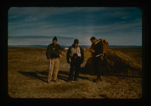 Image of Geology party of Needleman, Davies, and Klick leave base camp to examine sites