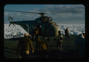 Image: Helicopter from USS Atka icebreaker lands after making reconnaissance