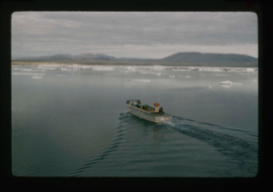 Image of Landing barge headed for shore of Polaris Bay through the floating icebergs