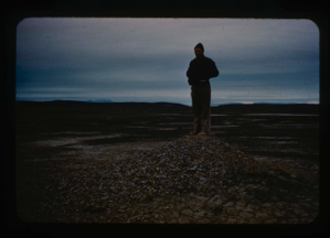 Image: Capt. Klick stands on frost heave mound on Polaris Promontory, west of site.