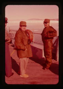 Image of Davies and Capt. Klick discuss ice conditions north of Thule AFB on the USS Atka
