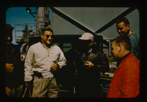 Image of Project Leader Needleman discusses projects with skipper of USS Atka and team
