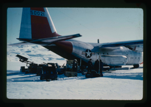 Image of Unloading of C-130 aircraft of equipment, supplies and vehicles in the snow 