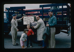 Image of Lt. Col. Wilson holds sign for special detachment of Operation Groundhog,Thule 