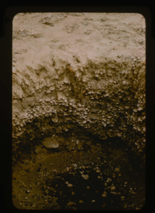 Image of Test pit in gravel surface of airstrip at Polaris Promontory. Strongly compacted
