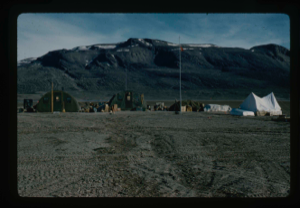 Image of View west of Centrum Lake Base Camp. Radio antennas and moist soil 