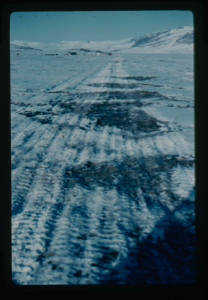 Image: Melting snow mounds on runway on delta at Centrum Lake. Note tents of base camp