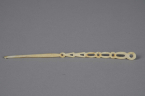 Image: Ivory crochet needle with 9 holes in handle