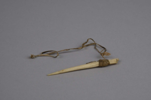 Image of Awl with twine and leather wrapping.
