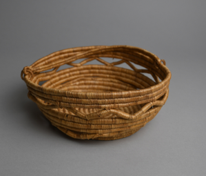 Image: Labrador-style turned grass basket w/open work. Damaged.