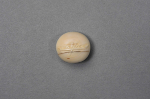 Image: Ivory button with bas relief kayaker