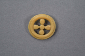 Image: Ivory circle pin with 5 round pieces forming a cross