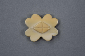 Image of Ivory pin, four-leaf clover shape with a cross in center