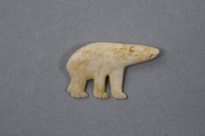 Image of Ivory pin, carved polar bear:  the  eyes, nose, mouth, hair